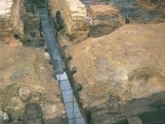 Photo of Pudding Lane excavation showing thick timber walls and lining the waterfront