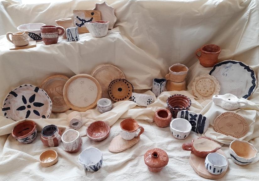 Photo of a range of plates, bowls and cups made by participants.