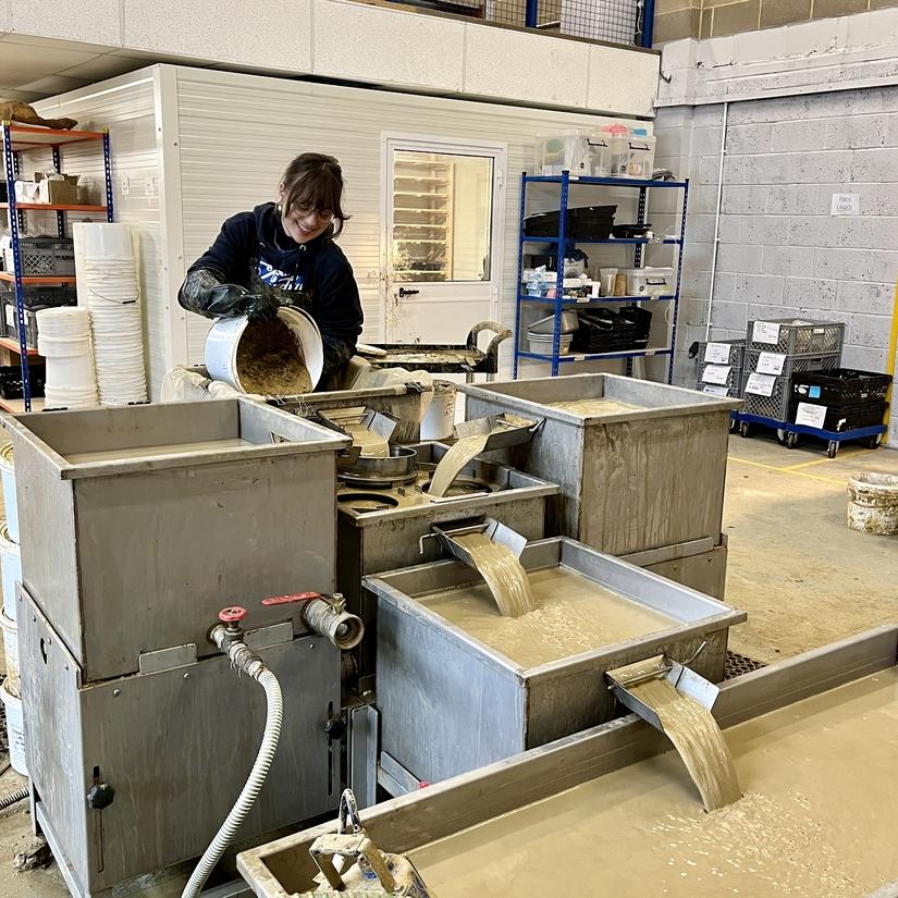 Environmental processor Willow adding a sample from the A428 to the wet sieving tank